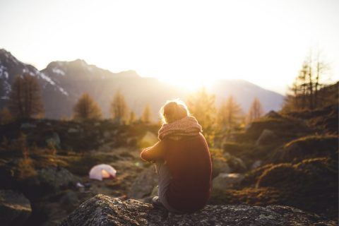 Wild camping lady outside at sunrise