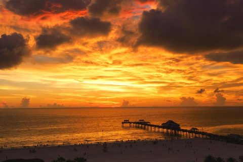 Sunset at Clearwater beach with stunning golden sky over Pier 60