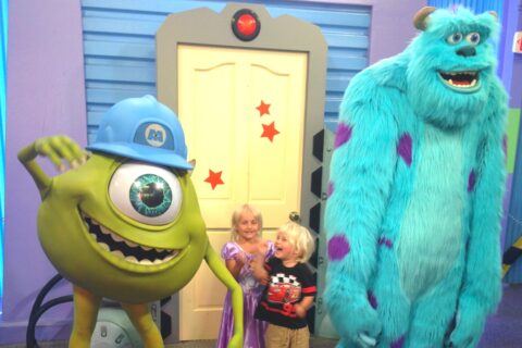 Small children with characters from Monsters Inc at Disney World Florida