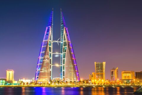 Manama on the Gulf coast at night with skyscrapers lit up