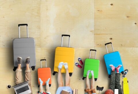 a family with suitcases in flatlay
